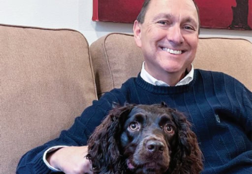 Paul Basha poses with his dog