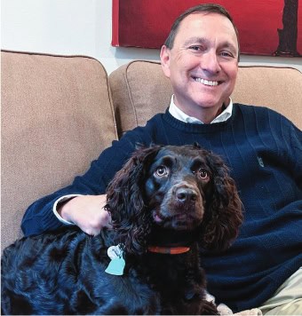 Paul Basha poses with his dog
