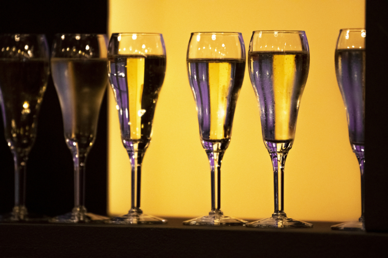 Backlit champagne glasses are ready for guests' arrival.