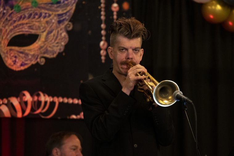 A young musician performs for the crowd.