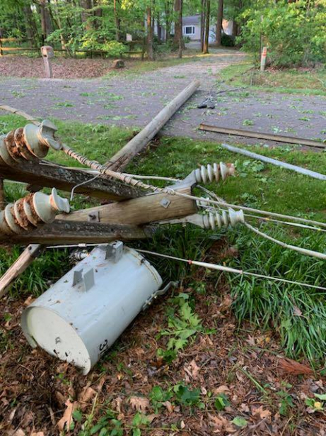 Broken electric pole wires and transformer on the ground