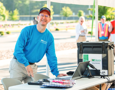 A co-op employee smiles for a photo