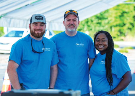 3 co-op workers pose for the camera